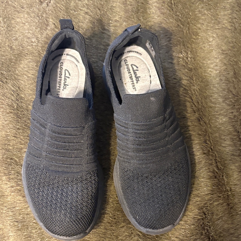 Clarks Women’s Black
Slip-On Sneakers